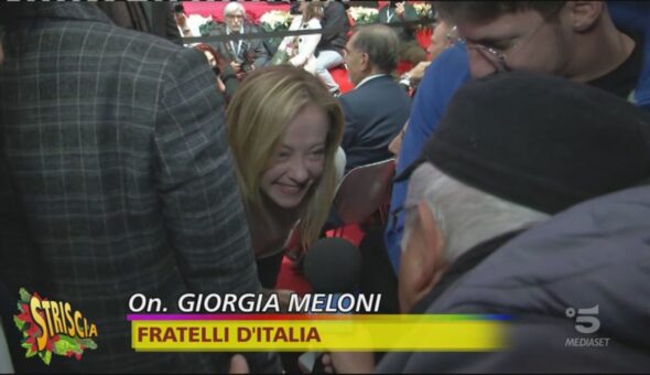 Dieci anni di Fratelli d'Italia, Lucci irrompe alla festa