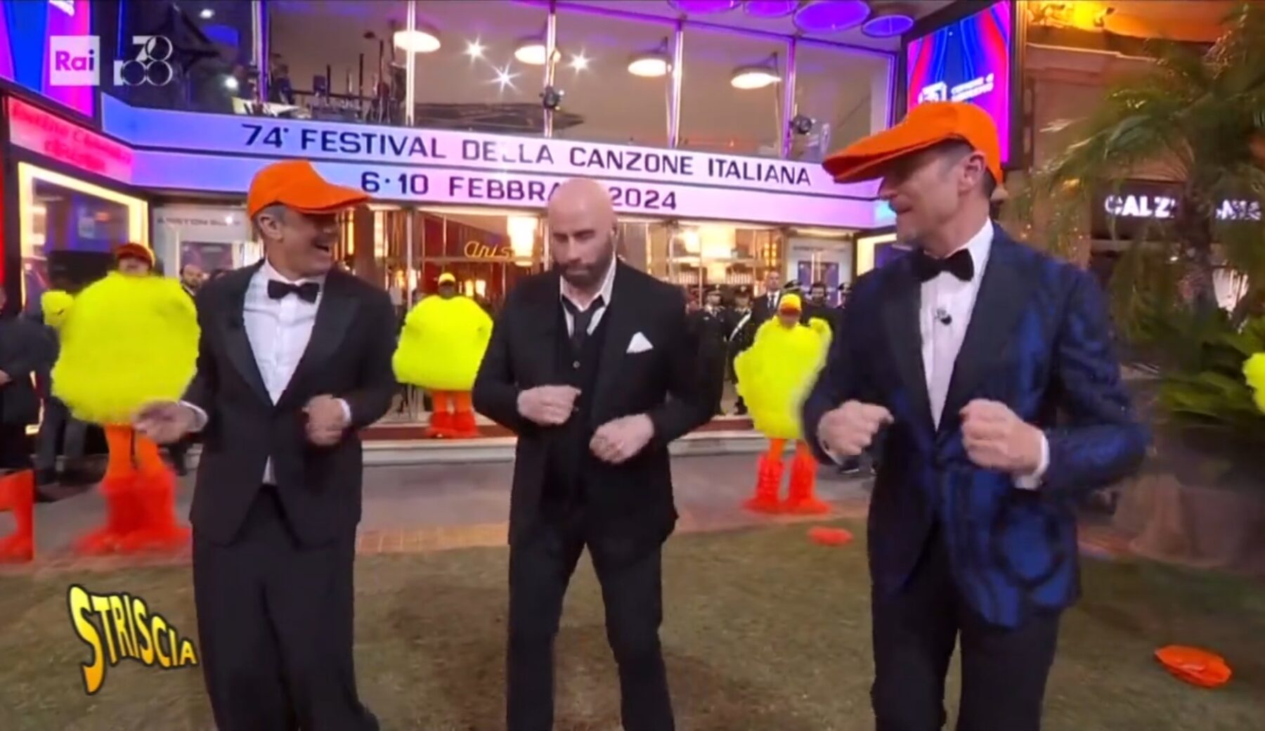 Sanremo, John Travolta, Fiorello e Amadeus “comunista” ballano il qua qua (della pubblicità?)